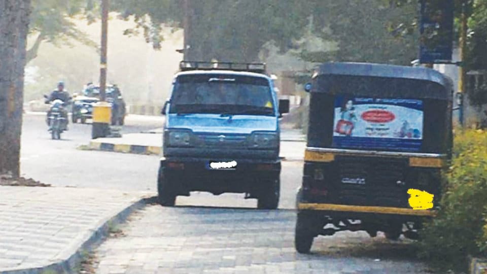 Pedestrian pathways on KRS Road used as parking lot
