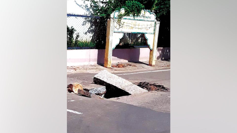 Caved-in road posing danger at Gandhinagar