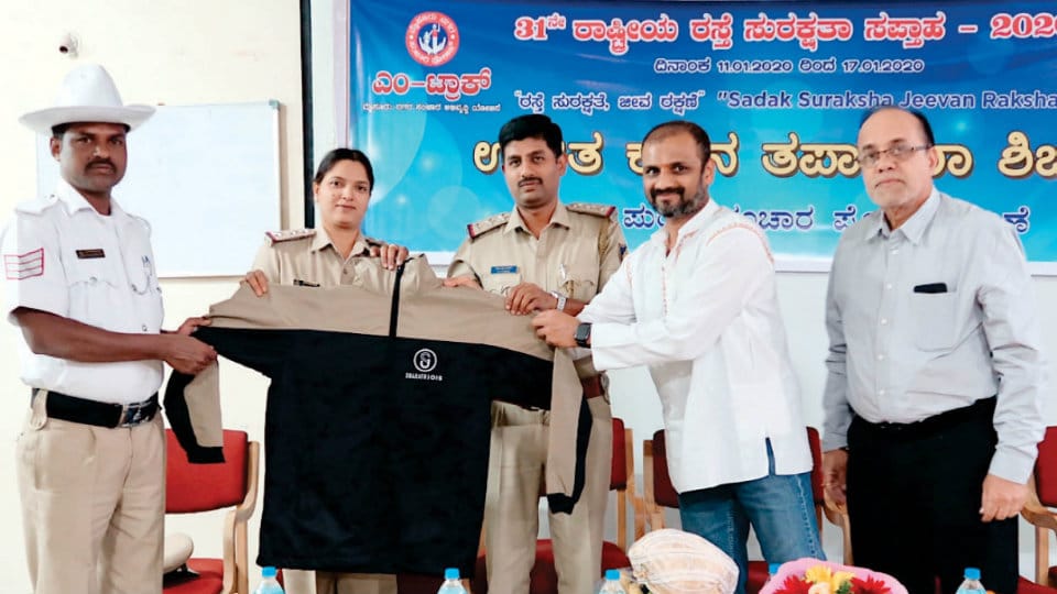 Yoga Centre distributes jackets to city cops