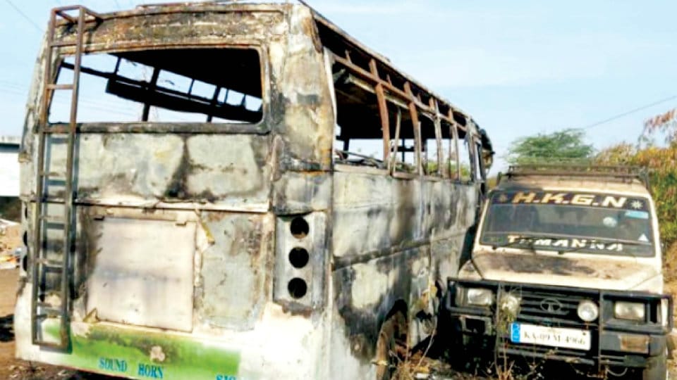 Stationary mini bus destroyed in fire at J.P. Nagar