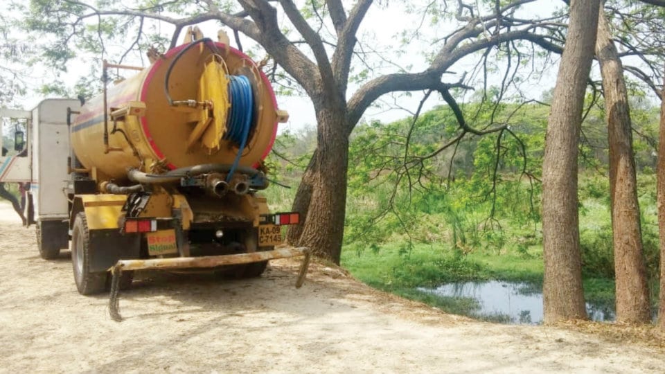 Cleaning of stagnant sewage water begins at Kukkarahalli Lake