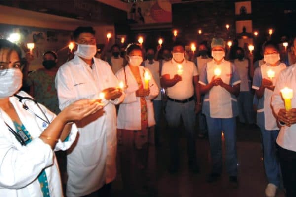 Cauvery Hospital staff light lamps to show solidarity