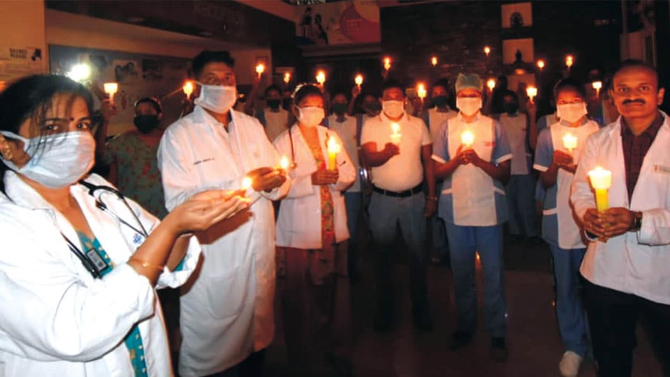 Cauvery Hospital staff light lamps to show solidarity