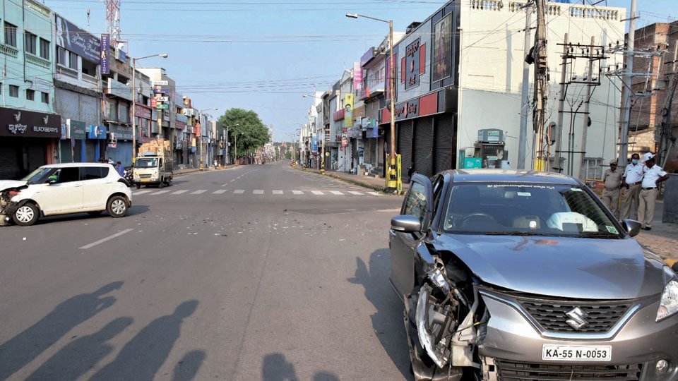 Cars collide on deserted Devaraj Urs Road