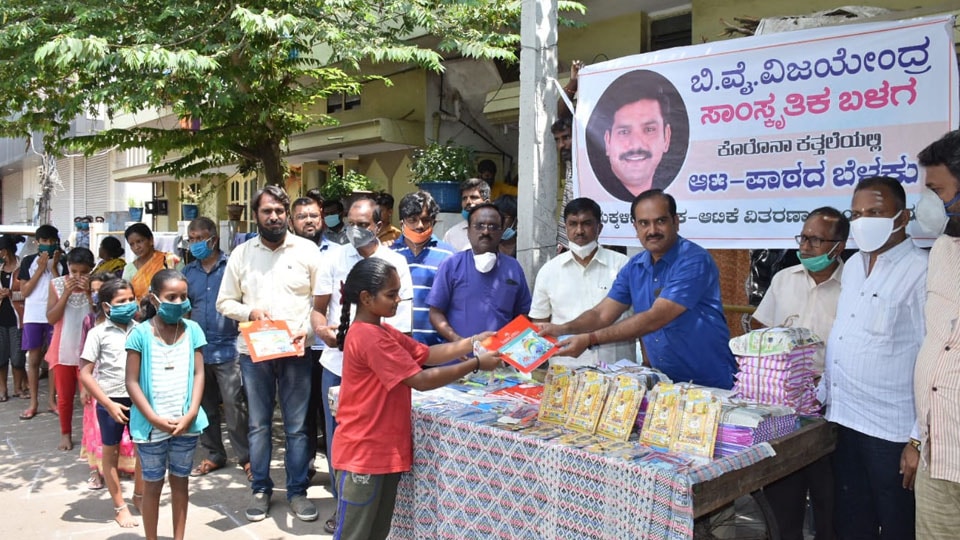 B.Y. Vijayendra Samskrutika Balaga distributes books to children