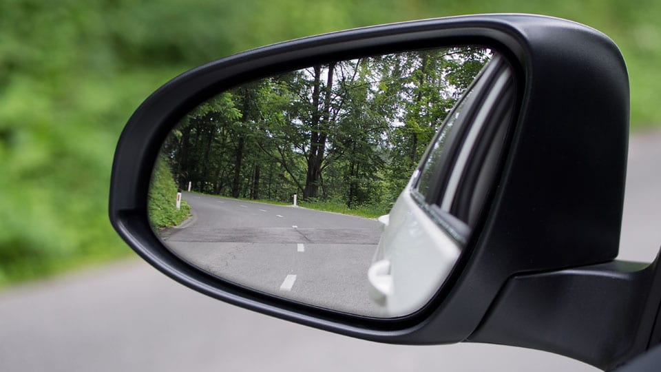 Use side-view mirrors while riding