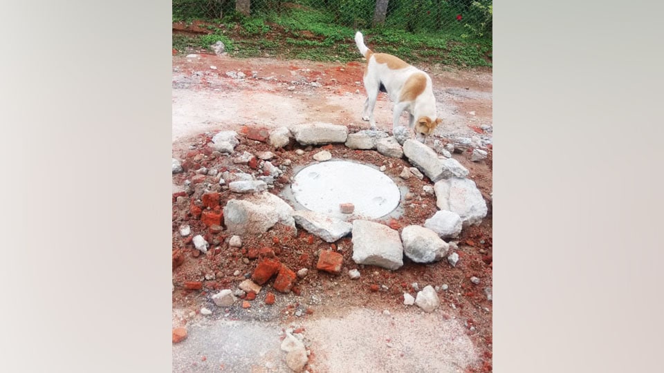 Debris around manhole needs to be cleared at Vijayanagar