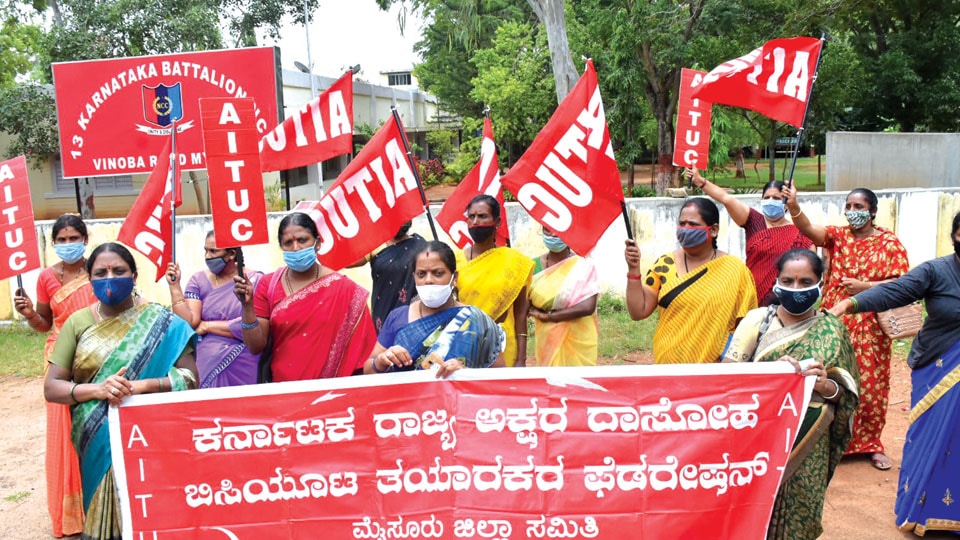 Mid-day meal workers stage demonstration seeking payment of wages