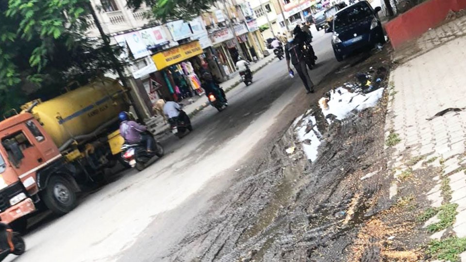Slush-filled Road near Agrahara Circle crying for attention