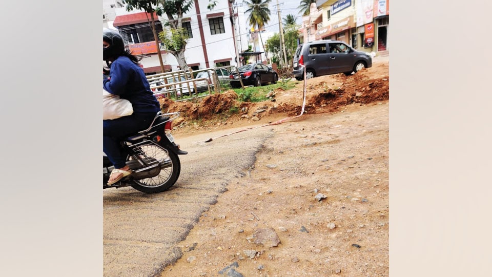 Plea to asphalt dug up portion of road in Saraswathipuram