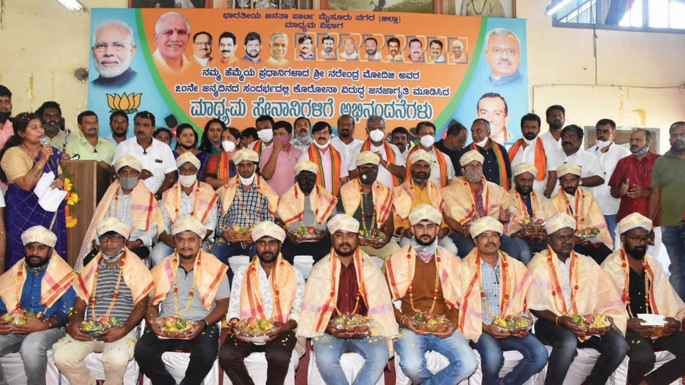 City BJP felicitates photojournalists, videographers for COVID fight