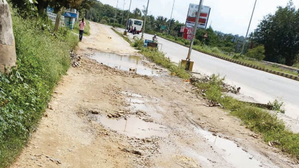 Will this Service Road near Bharath Cancer Hospital be asphalted?