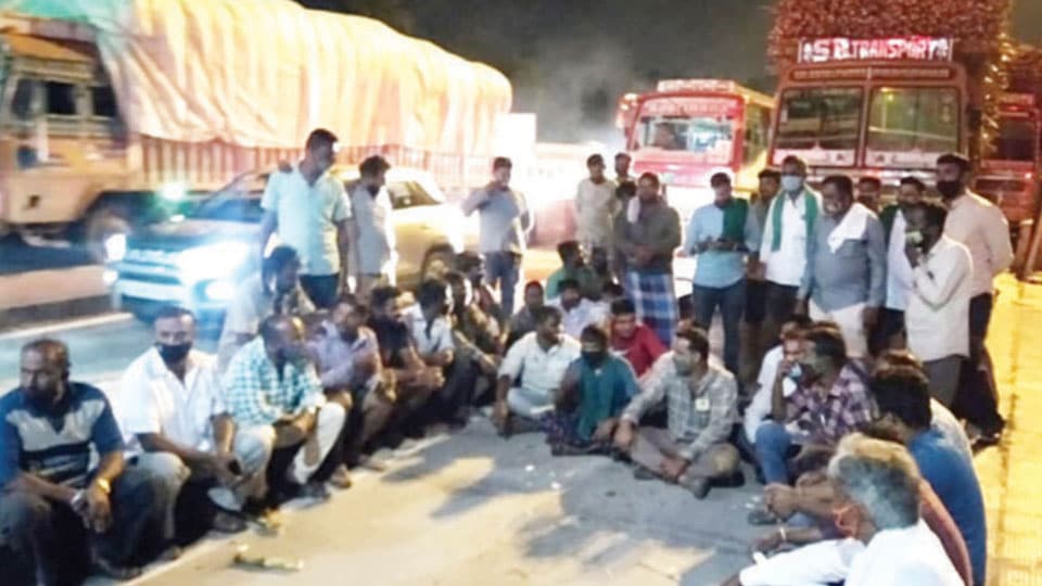 Opposition to Toll Fee collection: Sugarcane truck drivers stage protest at Toll Plaza on Mysuru-Nanjangud Highway