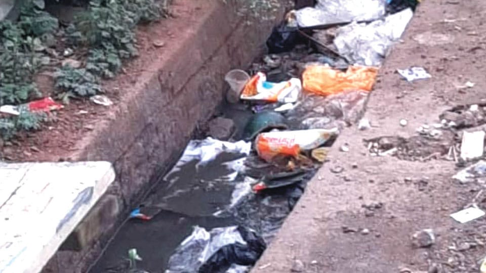 Plea to clear garbage dumped in drain at Kalyangiri