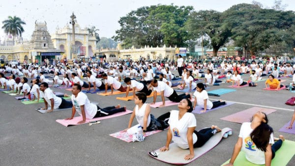 Over 500 perform Surya Namaskara, devotees offer puja to Palace Ratha ...