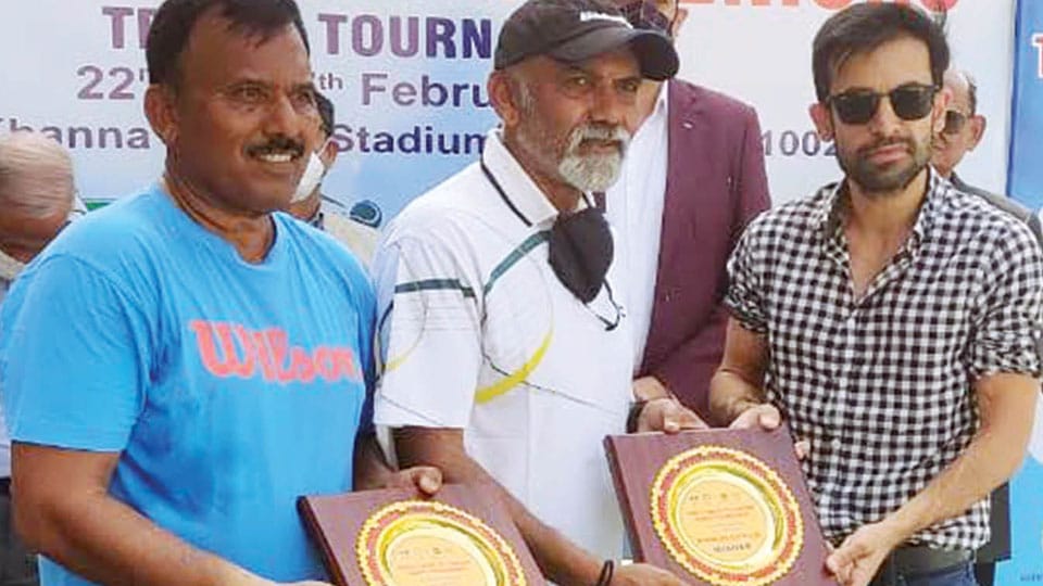 City veteran Tennis coach wins Doubles & Singles