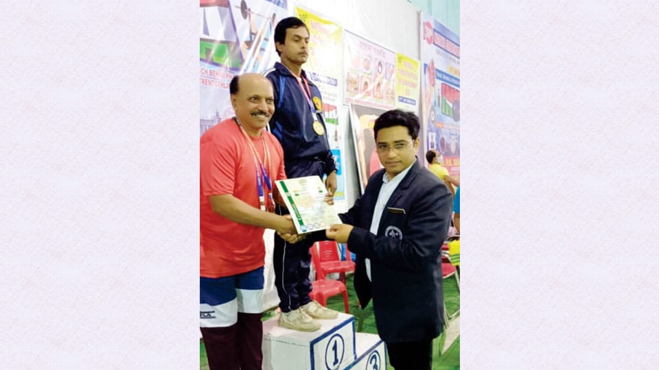 Wins medal in National Strength-Lifting Contest