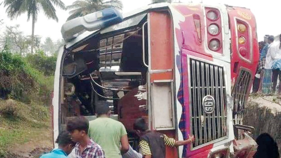 Passengers injured as bus falls into roadside ditch