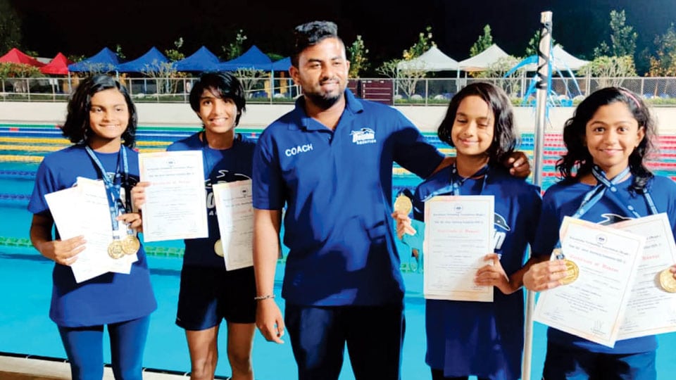 Wins medals in State-level Swimming Competition