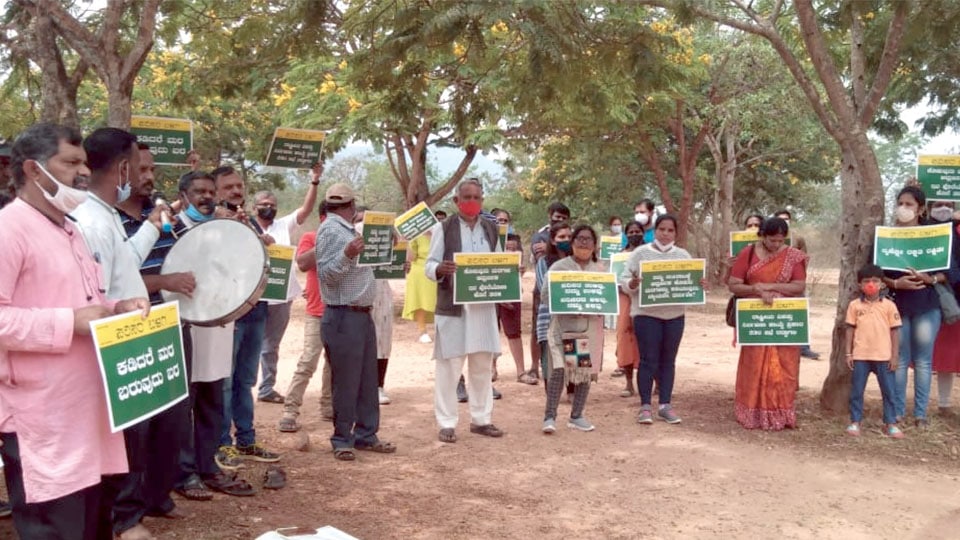 Activists stage demonstration against felling of trees for Heli-Tourism
