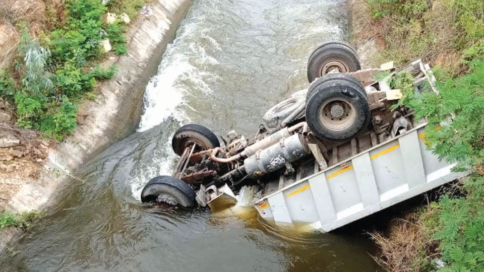 Miraculous escape for driver as tipper vehicle falls into canal