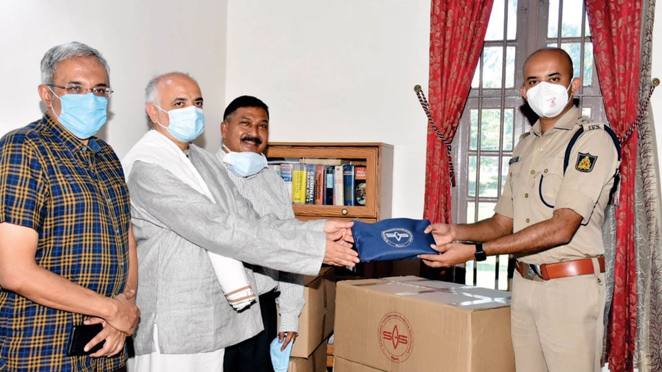 Ganapathy Sachchidananda Ashram donates medical kits to District Police