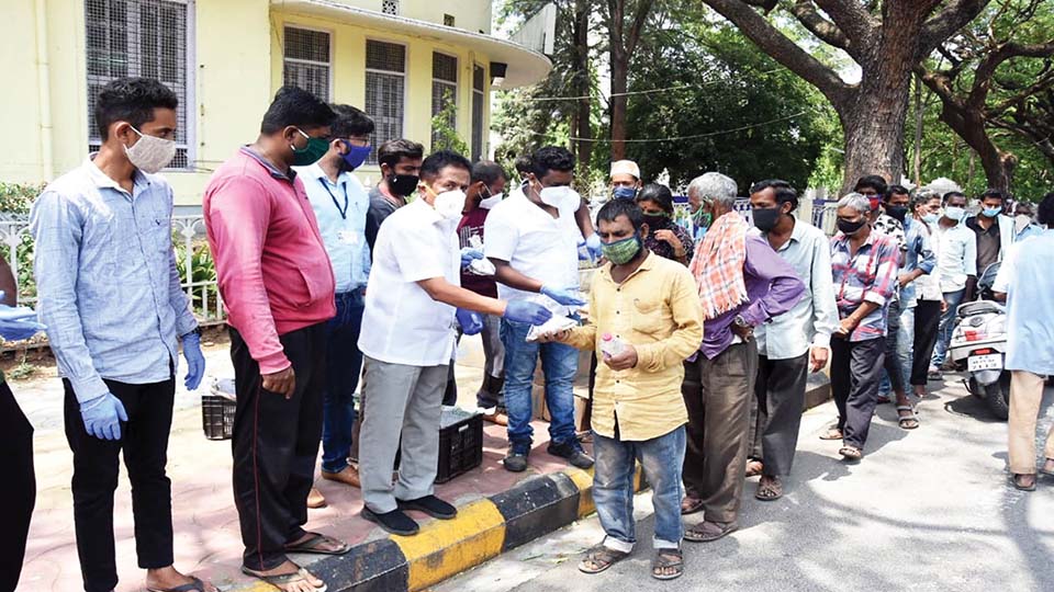 Former MLA distributes food packets