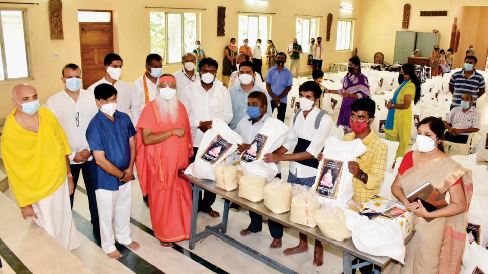 Ganapathy Ashram donates grocery kits to physically challenged persons