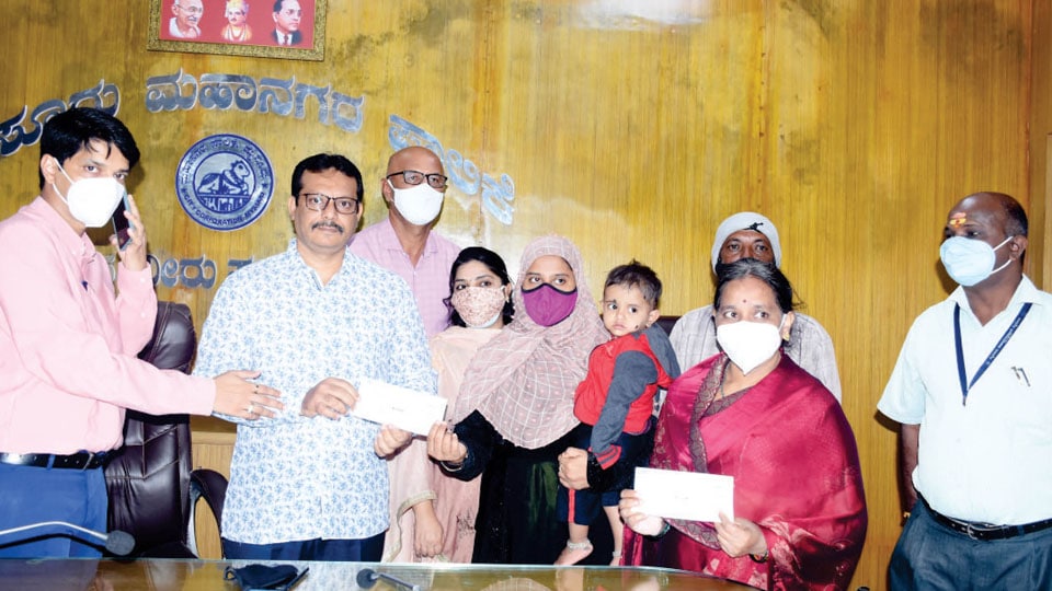 MCC distributes compensation cheque to families of two Covid victims