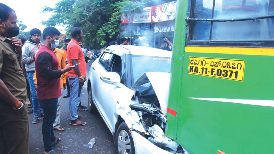 Freak mishap: Car rams into stationary bus from behind