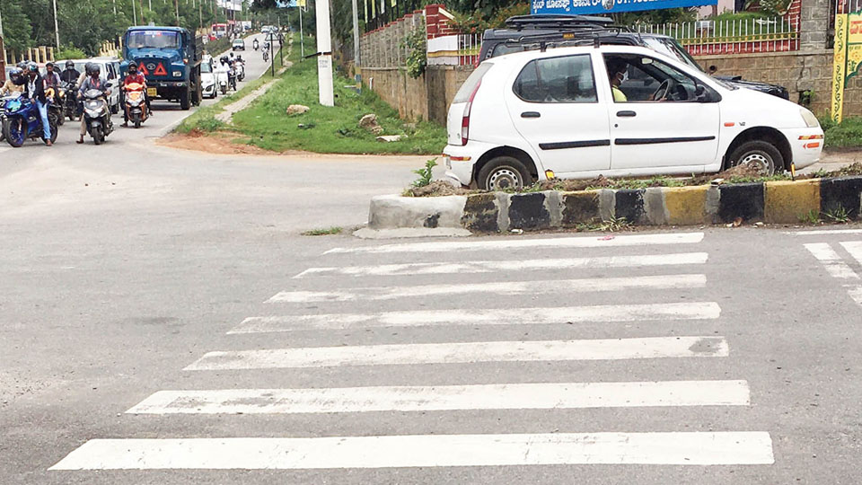 Extended central medians causing inconvenience to pedestrians