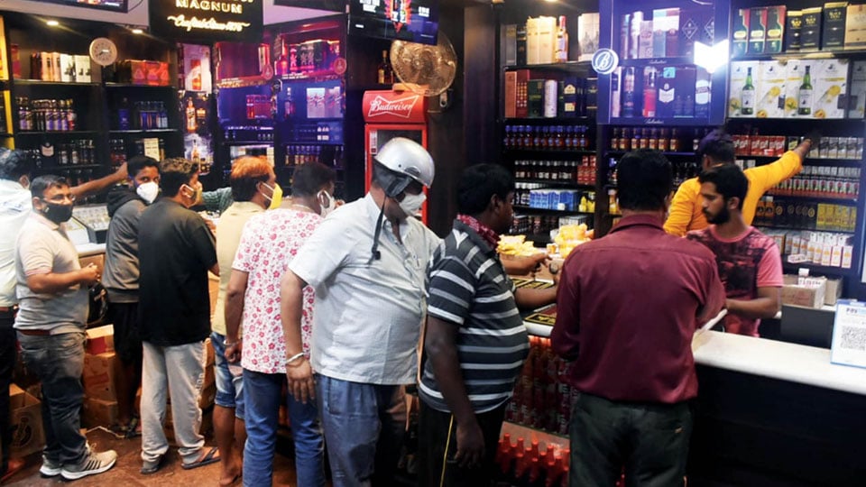 Liquor vends see unusual rush as people prefer stocking up