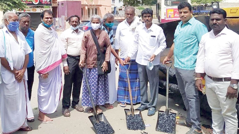 Corporator launches road asphalting works