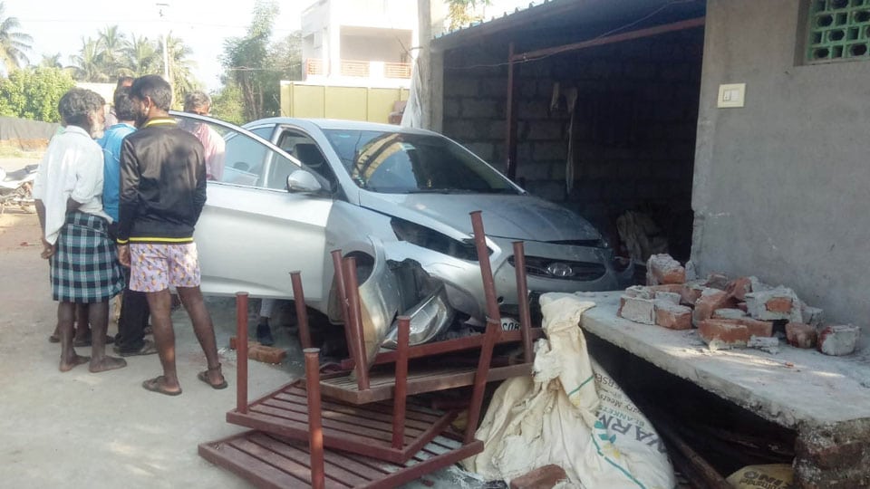 Woman injured as car ploughs into house