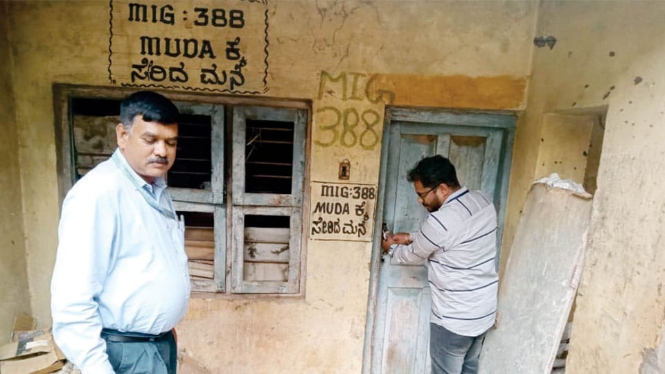 MUDA evicts illegal occupant of house at Devanur