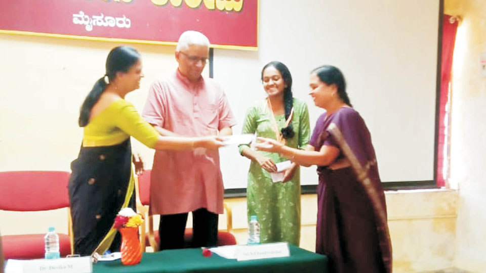 Silver medals and cash prizes presented to topper