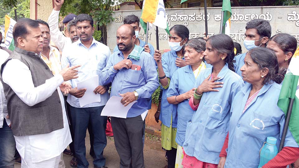 Dismissed contract workers stage protest near Divisional Railway Manager Office