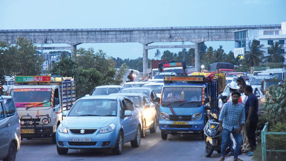 Day-long traffic bottleneck at Manipal Hospital Junction