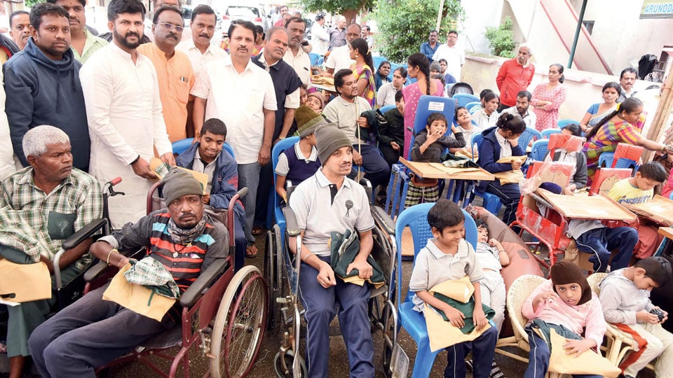 MP distributes uniform to special children