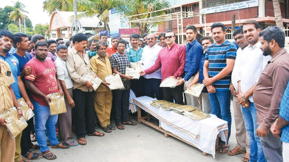 Free uniforms distributed to auto drivers