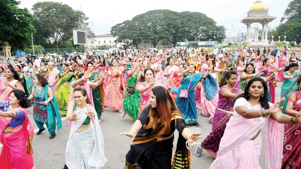 Women walk in sarees