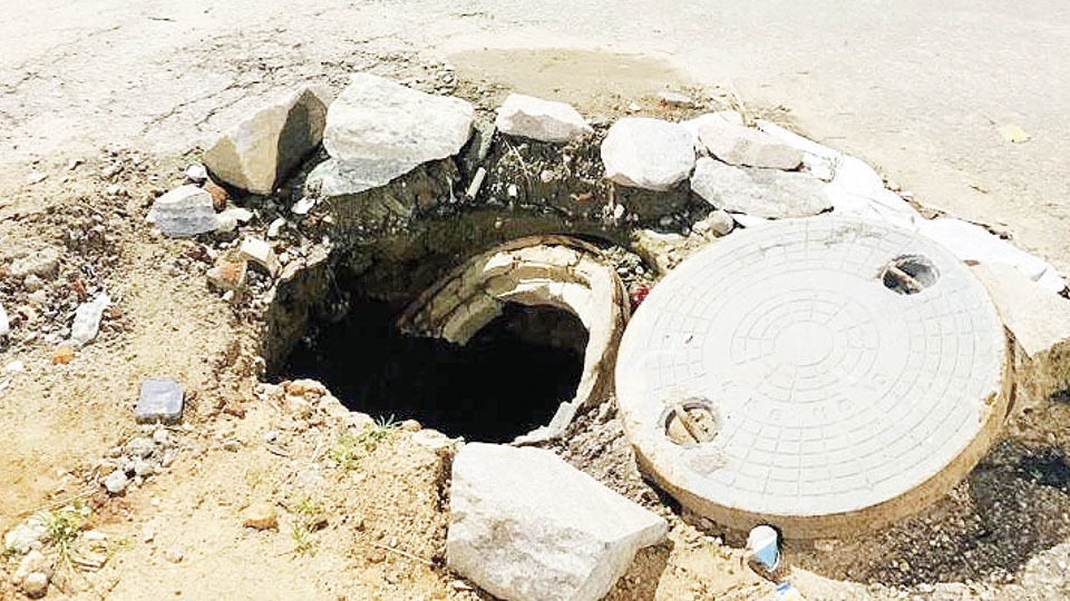 Damaged open manhole posing danger at Naidunagar