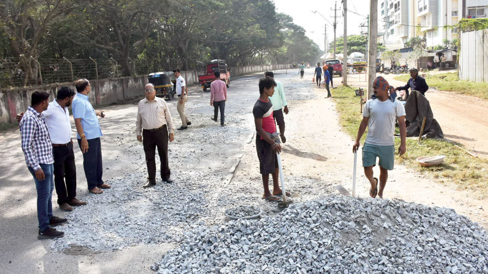 When will the pothole-filled Male Mahadeshwara Road be asphalted?