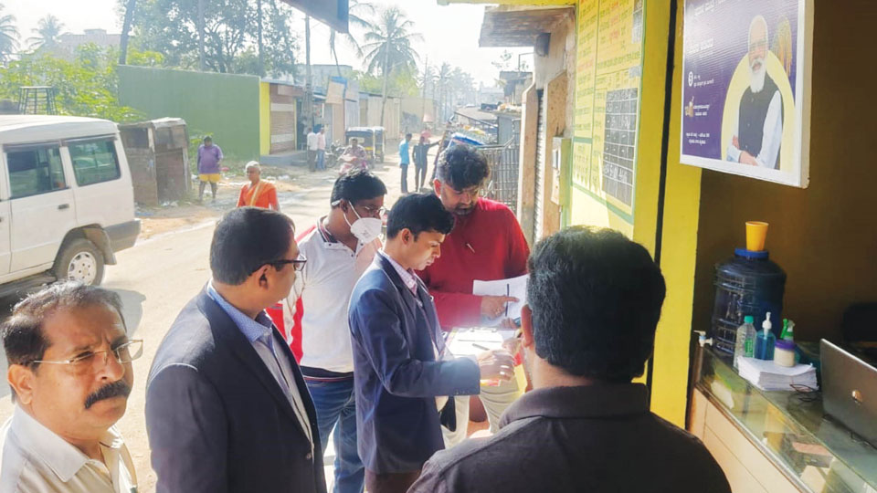 Food officials visit fair price shops to check distribution