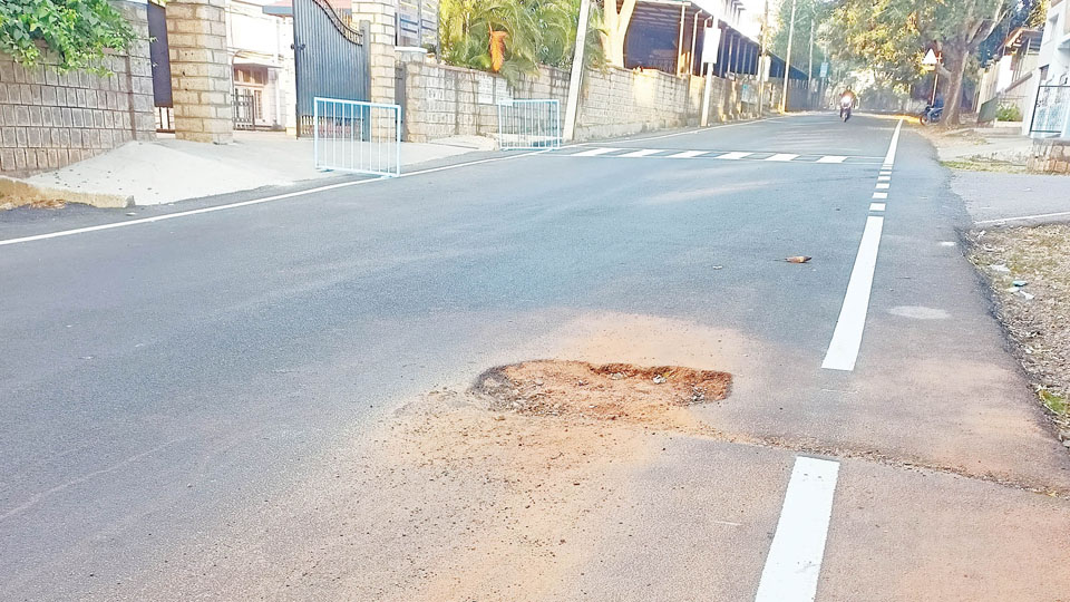 Patch on road sure to turn into pothole