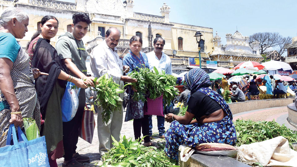 Ugadi festival eve brings people out to shop neem leaves