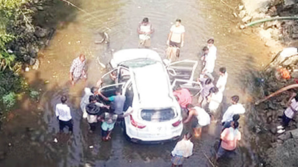 Lucky escape for four as car falls into canal