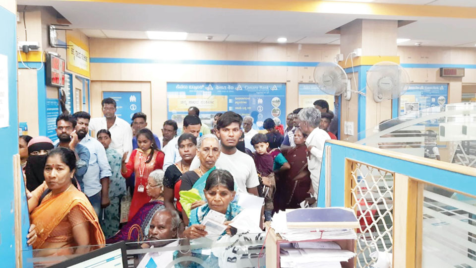 Gruha Lakshmi: Women throng banks
