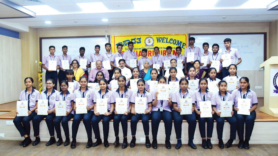 Distribution of scholarships, awards and felicitation to toppers