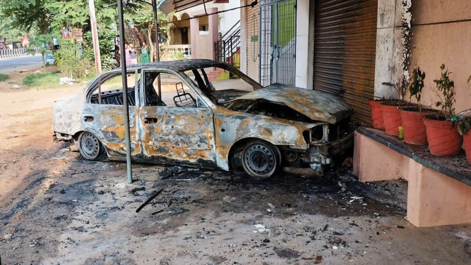 Car parked in front of house destroyed in fire